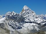 10 19 Mingbo La, Ombigaichen, Ama Dablam, Gauri Shankar, Drangnag Ri From West Col From the top of the West Col (6135m), the view to the west included Mingbo La at the far left, Tengi Ragi Tau in the distance, the pointy summit of Ombigaichen, Ama Dablam, and Gauri Shankar and Drangnag Ri in the distance to the right.